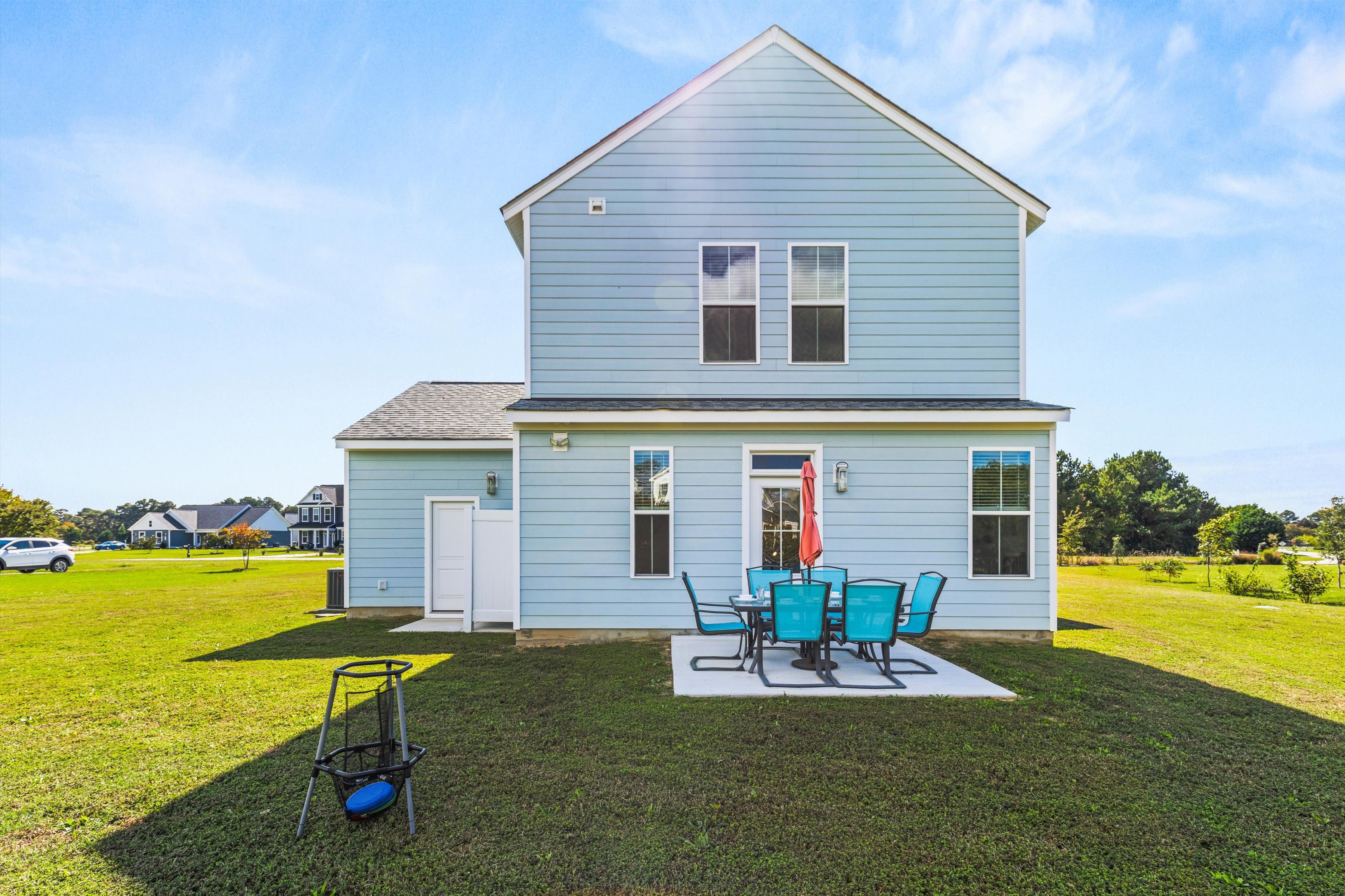 Spacious backyard with private patio dining and open grassy views