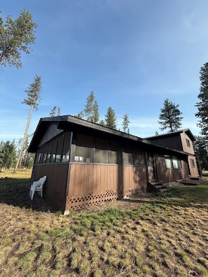 A modern two-story building with large windows and a wooden exterior. - House in Seeley Lake perfect for a relaxing getaway (Seeley Lake)