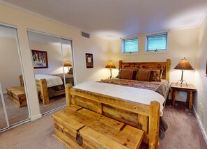 Unwind in your cozy bedroom with rustic wooden furnishings, soft bedding, and warm lighting that creates the perfect retreat after a day of adventure. - Bee Branch 04 SKin-in/out (Sugar Mountain)