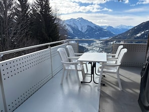 A balcony with a table and chairs, overlooking a mountainous landscape. - Clarossa Appartement/Fewo, Dusche oder Bad, WC 6-Bettwohnung by Interhome (Bellwald)