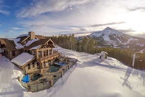 A lodge with a pool, ski lift, and a mountain view. - Cozy Big Sky 5 bedroom home with private Lodge access, ski in/out, NEW RELEASE (Big Sky)