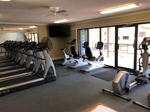 A gym with treadmills, stationary bikes, and elliptical machines. - NEW Hilton Head Beach & Tennis Resort Building B Tennis Villa! (Hilton Head)