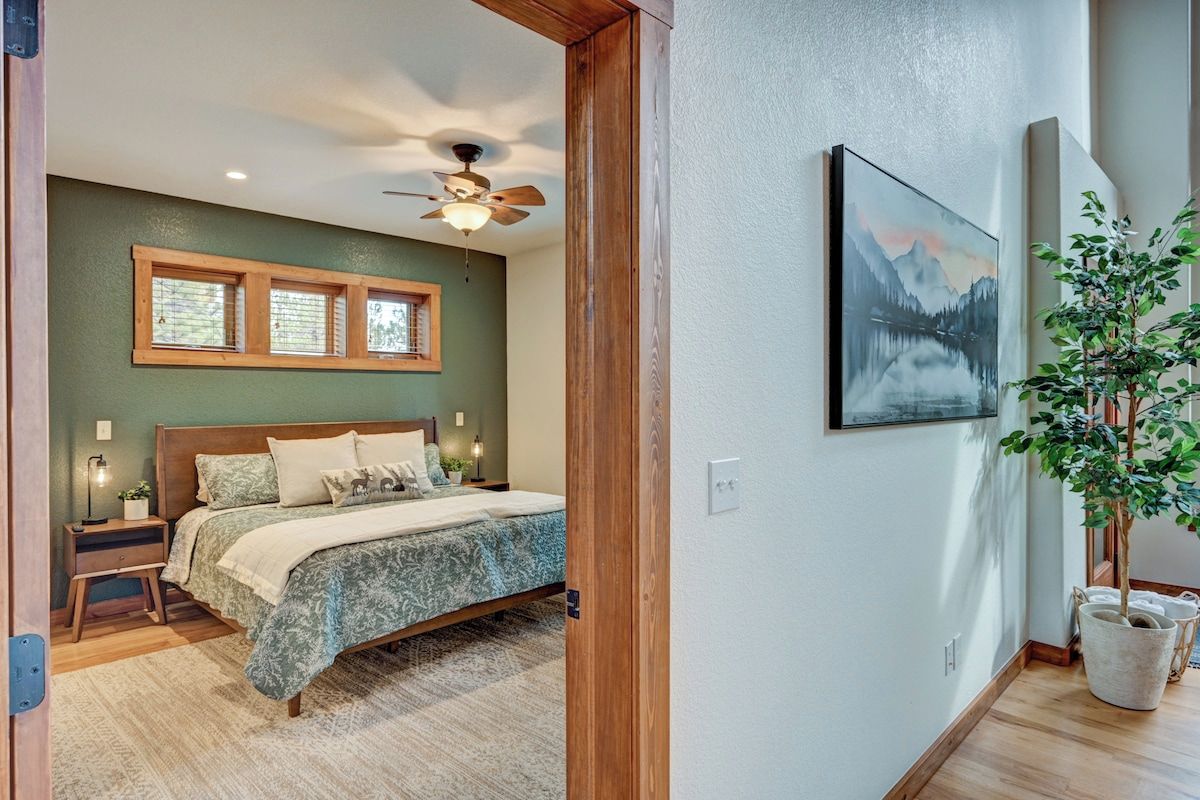 Main level master bedroom with walk-in closet and master bathroom.