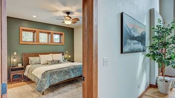 Main level master bedroom with walk-in closet and master bathroom.