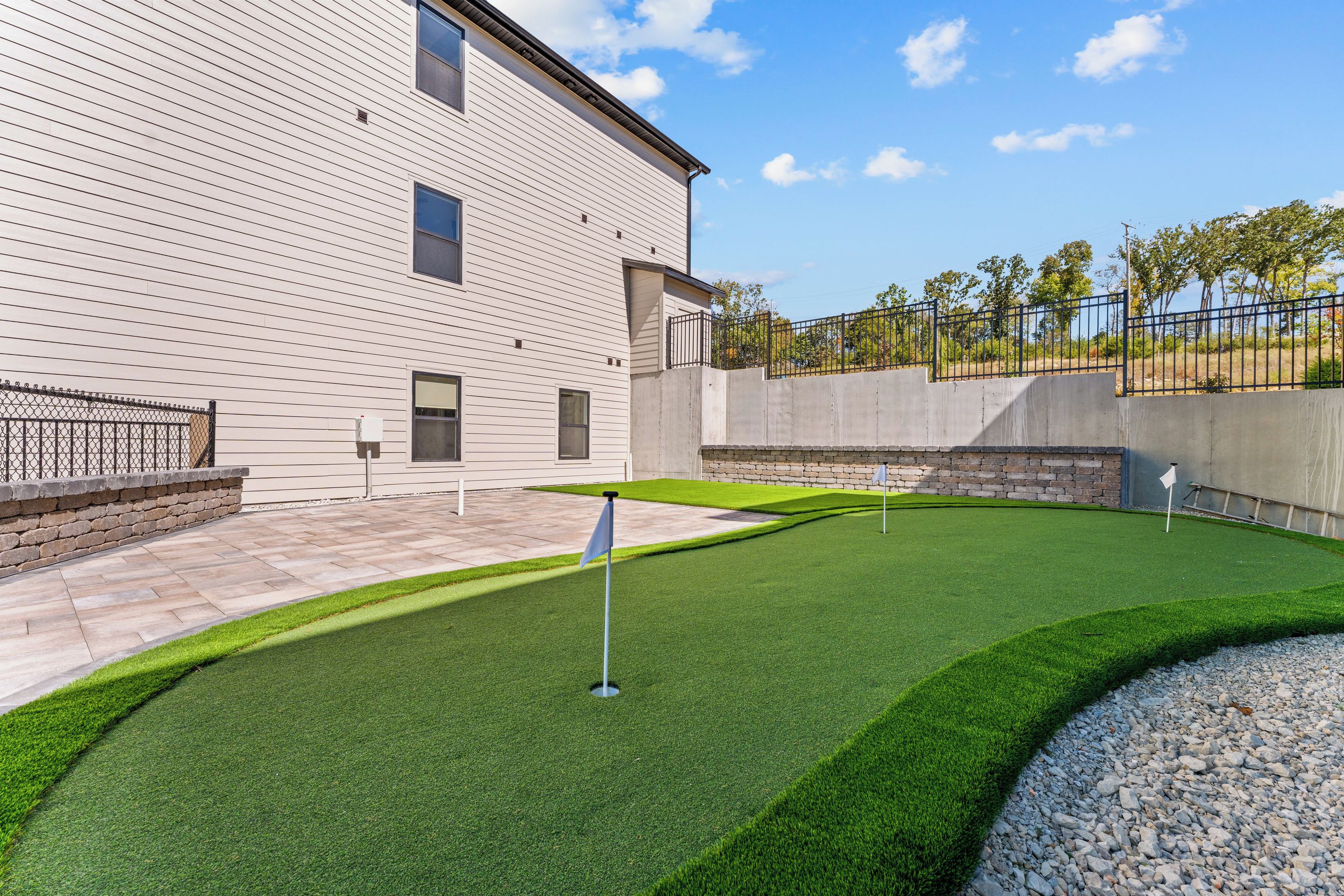 A building with a flat roof and a paved patio area.