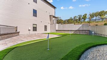 A building with a flat roof and a paved patio area.