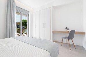 A bedroom with a bed, a desk, and a chair. - Le Mont Blanc | Large Group Villa Sleeps 13 Guests (Kounoupidiana)