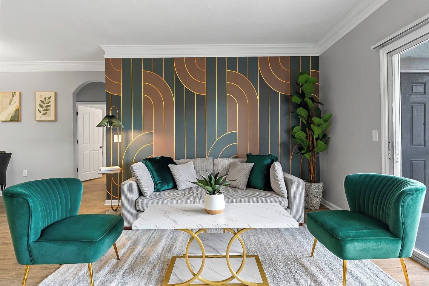 A modern living room with a sofa, two armchairs, a coffee table, and a decorative wall with vertical lines. - Modern 3BR Orlando Escape | Pool & Theme Parks (Orlando)