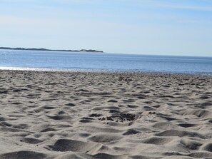 A sandy beach with gentle waves and a clear sky. - Holiday Home in Wrixum on Fohr With Sauna (Wrixum)
