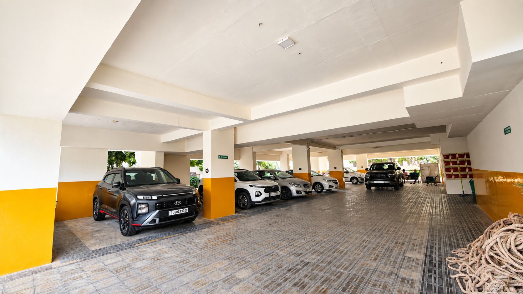A multi-level parking garage with several cars parked.