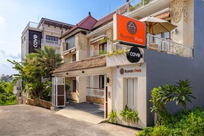 A two-story building with a sign for 'Rumah Padi' and a 'Cove' sign, indicating a possible hotel or resort. - Cove Rumah Padi (Kabupaten Badung)