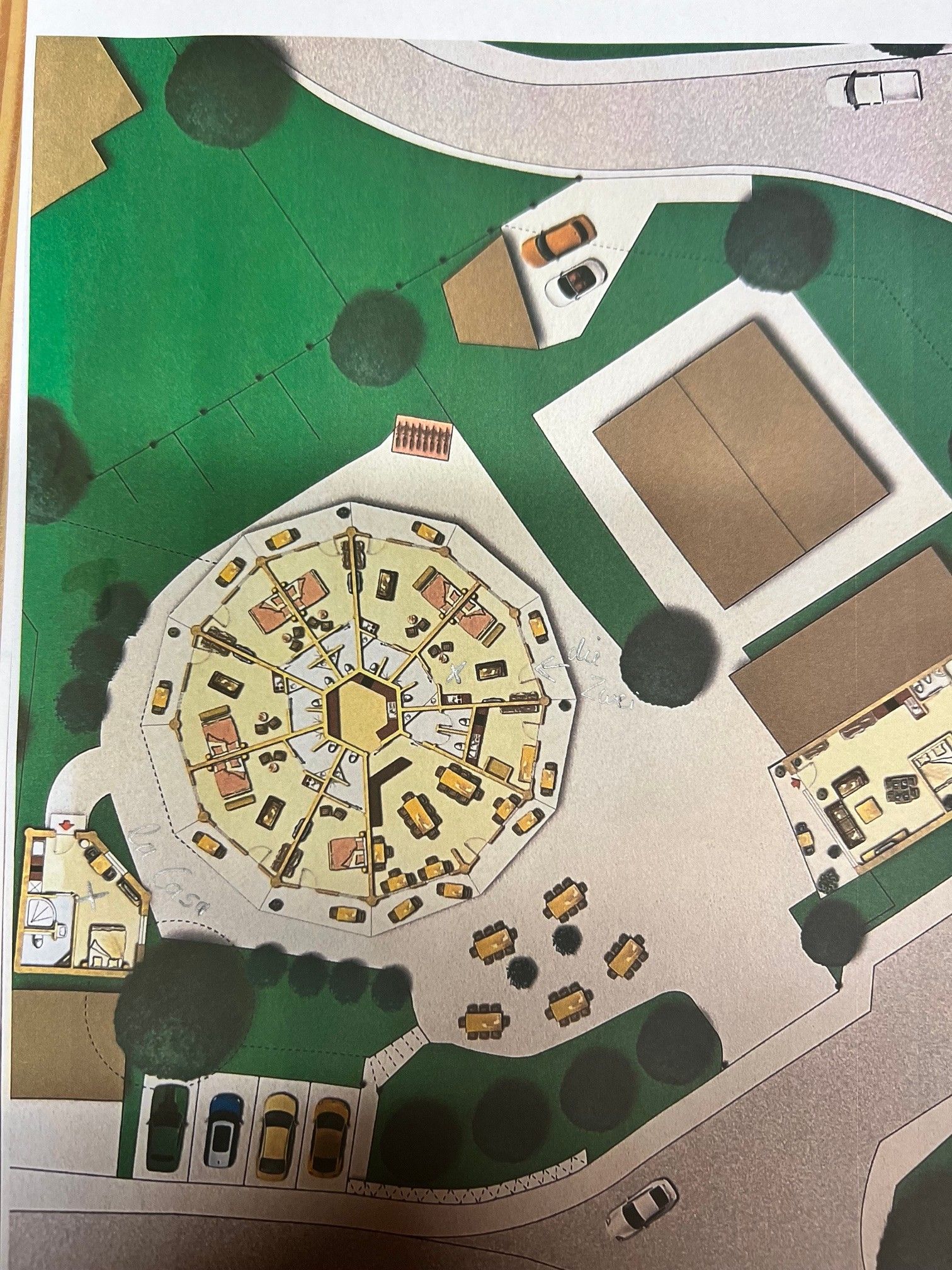 Ein detaillierter Grundriss eines Parks mit einem zentralen, kreisförmigen Bereich, umgebenden Gebäuden und Parkplätzen.