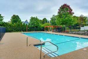 A swimming pool with a wooden deck, a covered seating area, and a fenced garden. - 10 Mi to Gunstock Resort! Condo Near Lake Access (Laconia)