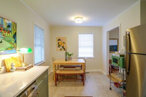 A kitchen with a dining table, chairs, a refrigerator, and a microwave. - Game Day Base! 1 Mi to Ole Miss & Oxford Square (Oxford)