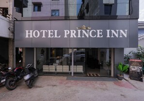 A hotel entrance with a sign reading 'HOTEL PRINCE INN.' - Hotel Prince Inn (Chandrapur)