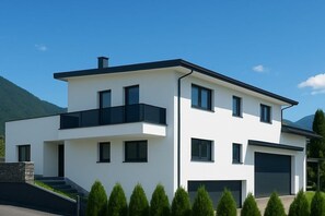 A modern two-story house with a flat roof, large windows, and a garage. - Apartment in Ehrwald with swimming pool (Ehrwald)