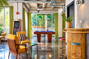 A billiards room with a pool table, chairs, and a bar area. - Max Brown Hotel Downtown, part of Sircle Collection - Small Double Room (Athens)