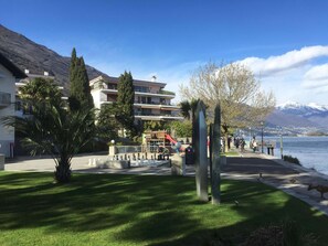 A waterfront property with a chessboard, a playground, and a mountain backdrop. - Casa Felice by Interhome (Brissago)