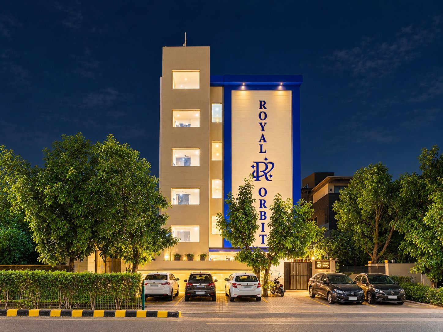 A hotel with a prominent vertical sign reading 'ROYAL ORBIT.'