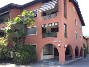 A multi-story building with a sign reading 'RESIDENZA SABRINA.' - Residenza Sabrina App. 09 by Interhome (Ascona)