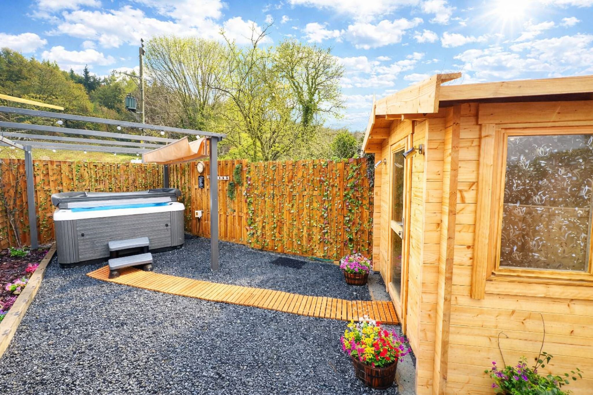 A wooden cabin with a hot tub, a pergola, and a wooden deck.