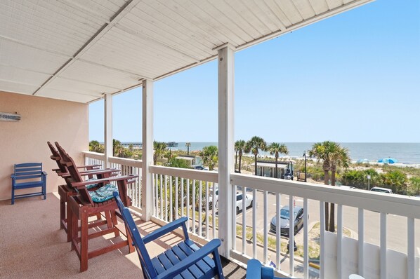 A covered outdoor area with a view of the beach and ocean. - Oceanfront Views, Beach Steps Away, Walk Everywhere by Tybee Cottages (Tybee Island)