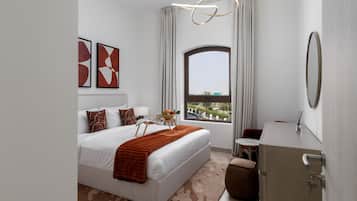 A modern hotel room with a large bed, a bedside table with a lamp, a small table with fruit and a magazine, a view through a large window, and a mirror on the wall.