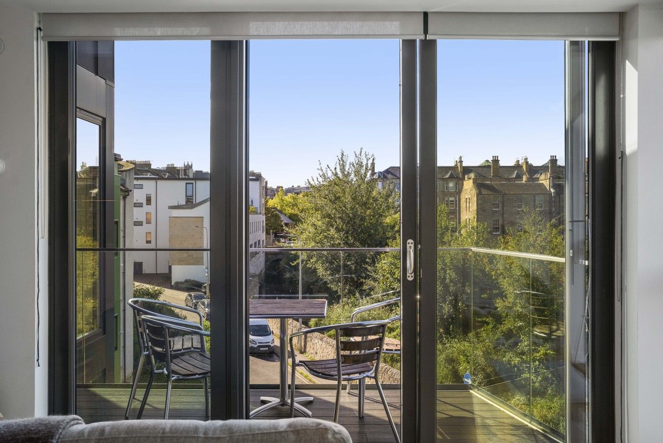 Step out onto the private balcony and enjoy leafy views across Canonmills