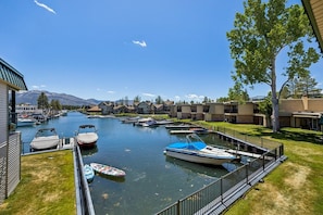 A marina with boats docked, a clear sky, and a mountain in the background. - 439 Ala Wai, 116 3 Bedroom Condo (South Lake Tahoe)