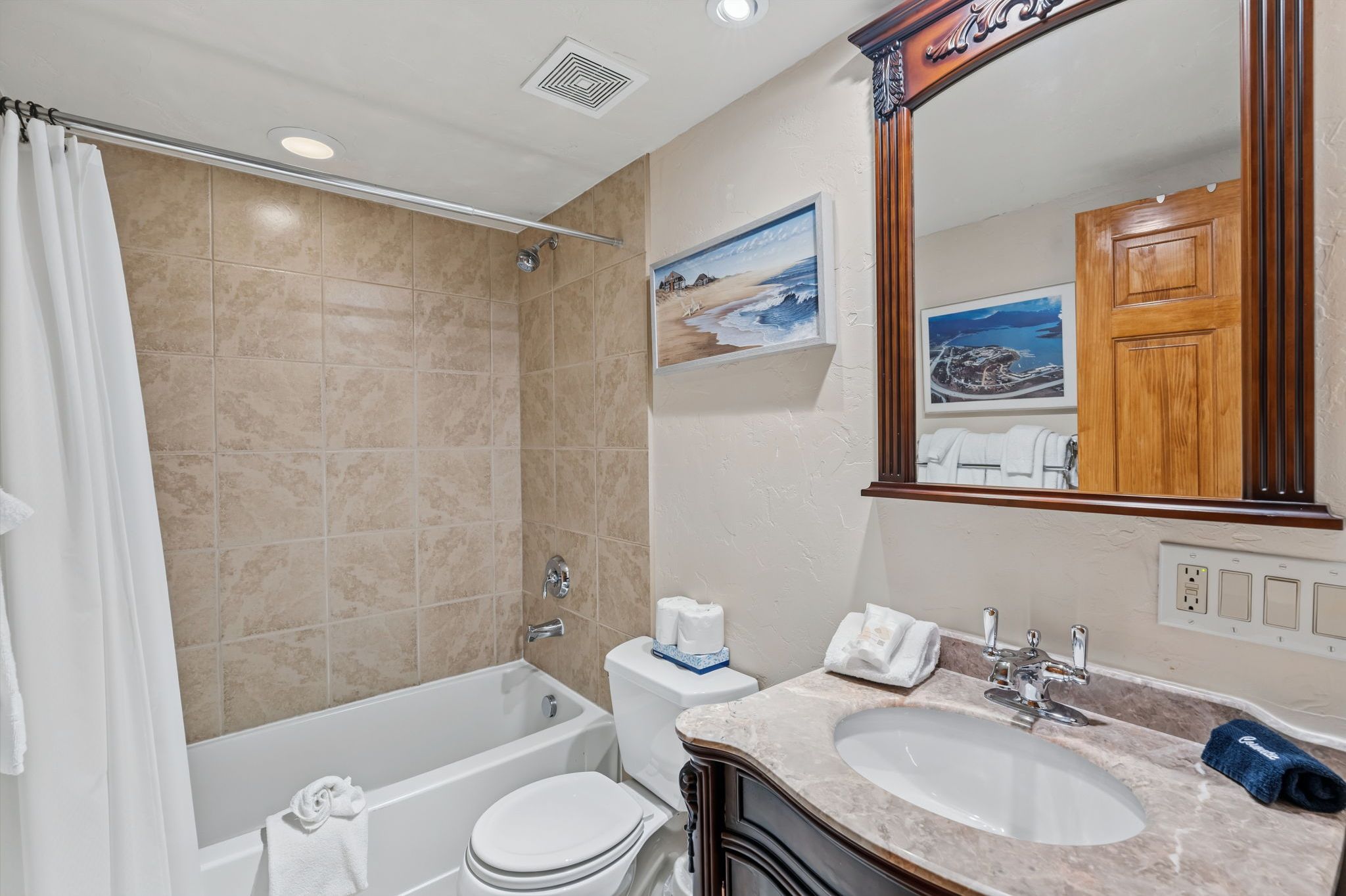 Step into your beautifully tiled Second bathroom with a deep soaking tub, and elegant marble countertops.