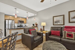 A modern kitchen with stainless steel appliances and pendant lighting. - Premium Unit 3313 - One Bedroom w/Full Kitchen- Fraser Crossing/Founders Pointe 1 Condo (Winter Park)