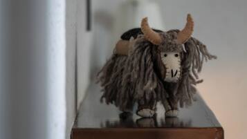 A shelf with a stuffed animal.