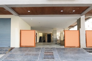 A covered entrance with a staircase leading to a hallway. - Hotel O SV  (Hyderabad)