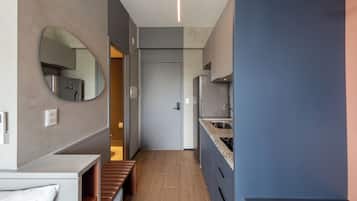 A modern kitchen with a built-in oven, a sink, and a countertop.