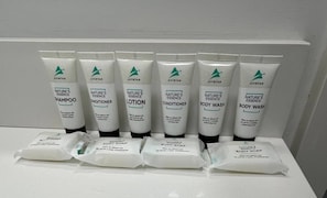 A display of Avistar Nature's Essence products including shampoo, conditioner, lotion, body wash, and body soap. - Sol Harbour Apartment in Ocho Rios (Ocho Rios)