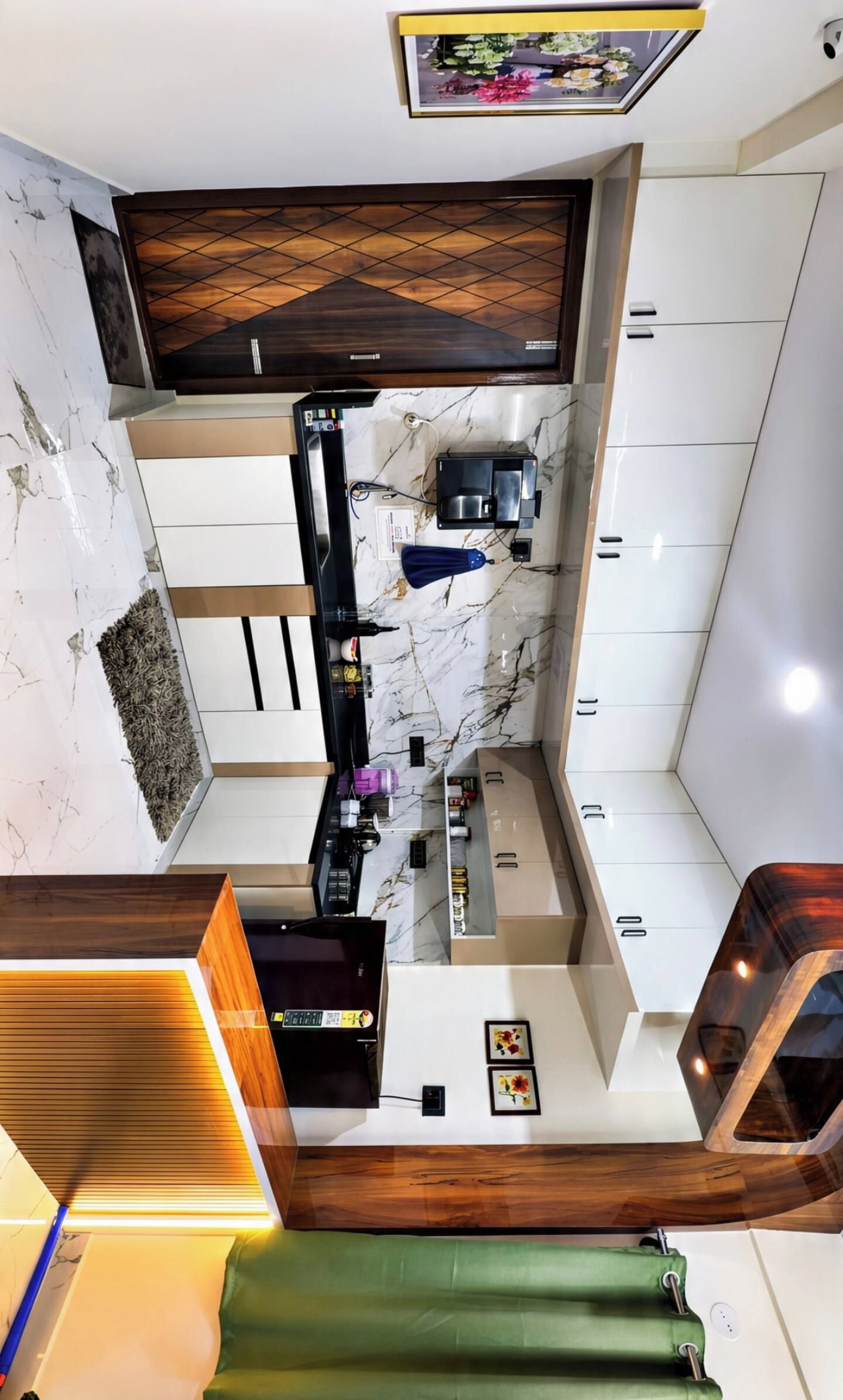 A modern kitchen with a marble backsplash, wooden cabinets, and a built-in microwave.