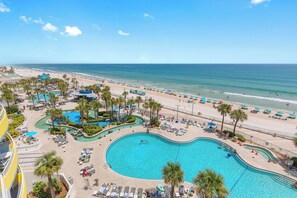 A resort with a large pool, beach, and ocean view. - ☀️Ocean Front Condo with Expansive Views-Daytona Ocean Walk Resort 706☀️ (Daytona Beach)
