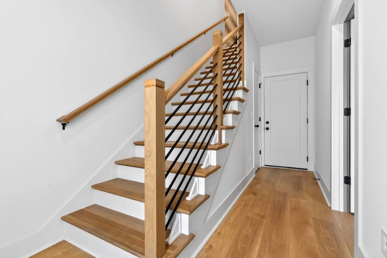 Stairs from the first floor to the main second floor.