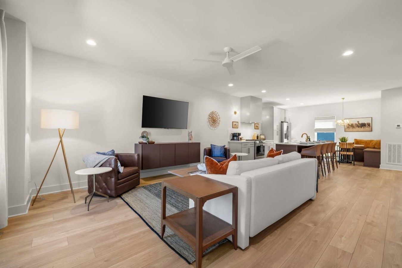 A modern living room with a sofa, coffee table, and floor lamp.