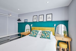 A modern bedroom with a bed, a desk, and a chair. - Host Stay Fish Quay View (North Shields)