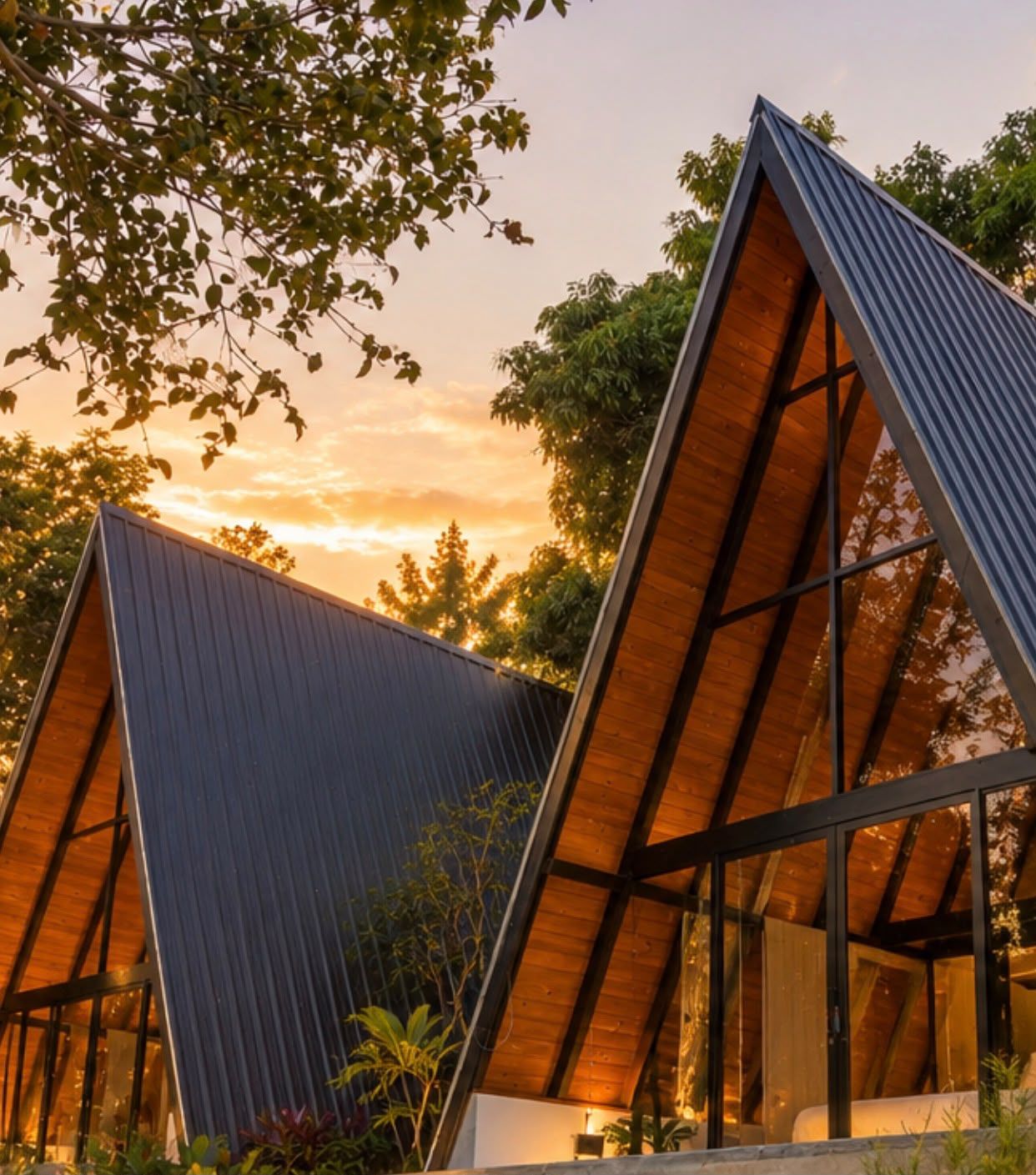 A modern building with a triangular roof structure and large windows.