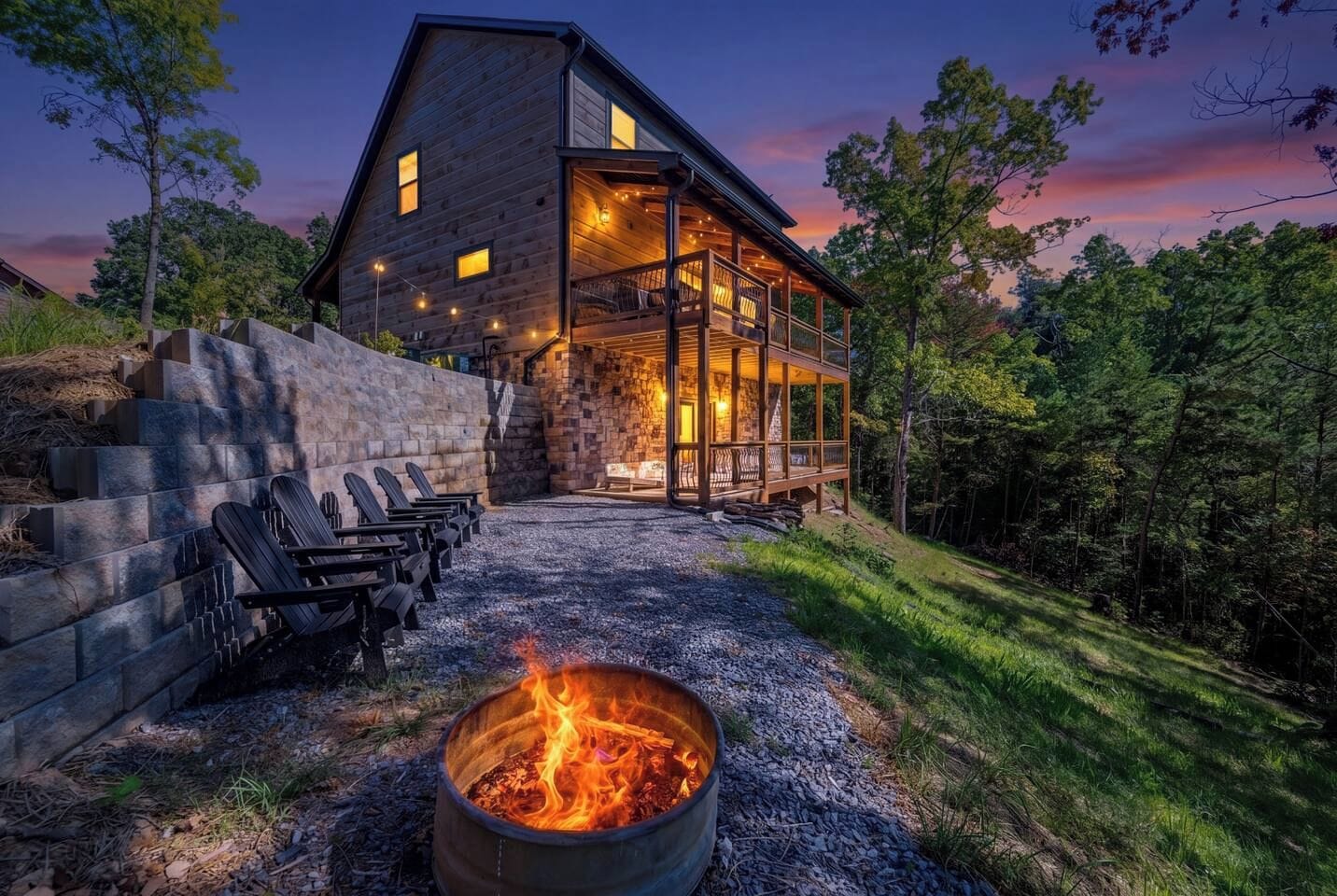 A modern log cabin with a stone exterior, a fire pit, and outdoor seating.