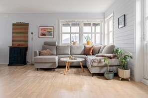 A stylishly furnished living room where relaxation comes as naturally as the Arctic light - Tromsø 80 m² Apartment with balcony sea view (Tromsø)