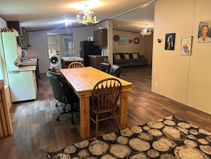 A compact living space with a dining area, kitchen, and a gray sofa. - 4 Bedrooms In Nature Only 35 Min. to Gatlinburg (Cosby)