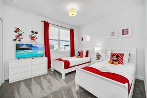 A hotel room with two beds, a TV, and red accents. - EV_9085 - 5 Bed 5 Bath Villa with Private Pool with Spillover Spa, Custom Games (Davenport)
