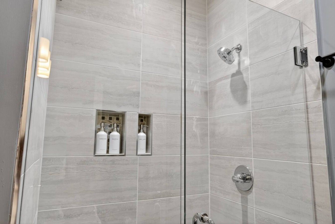 Private en-suite bathroom attached to Bedroom 1, featuring a spacious walk-in shower.