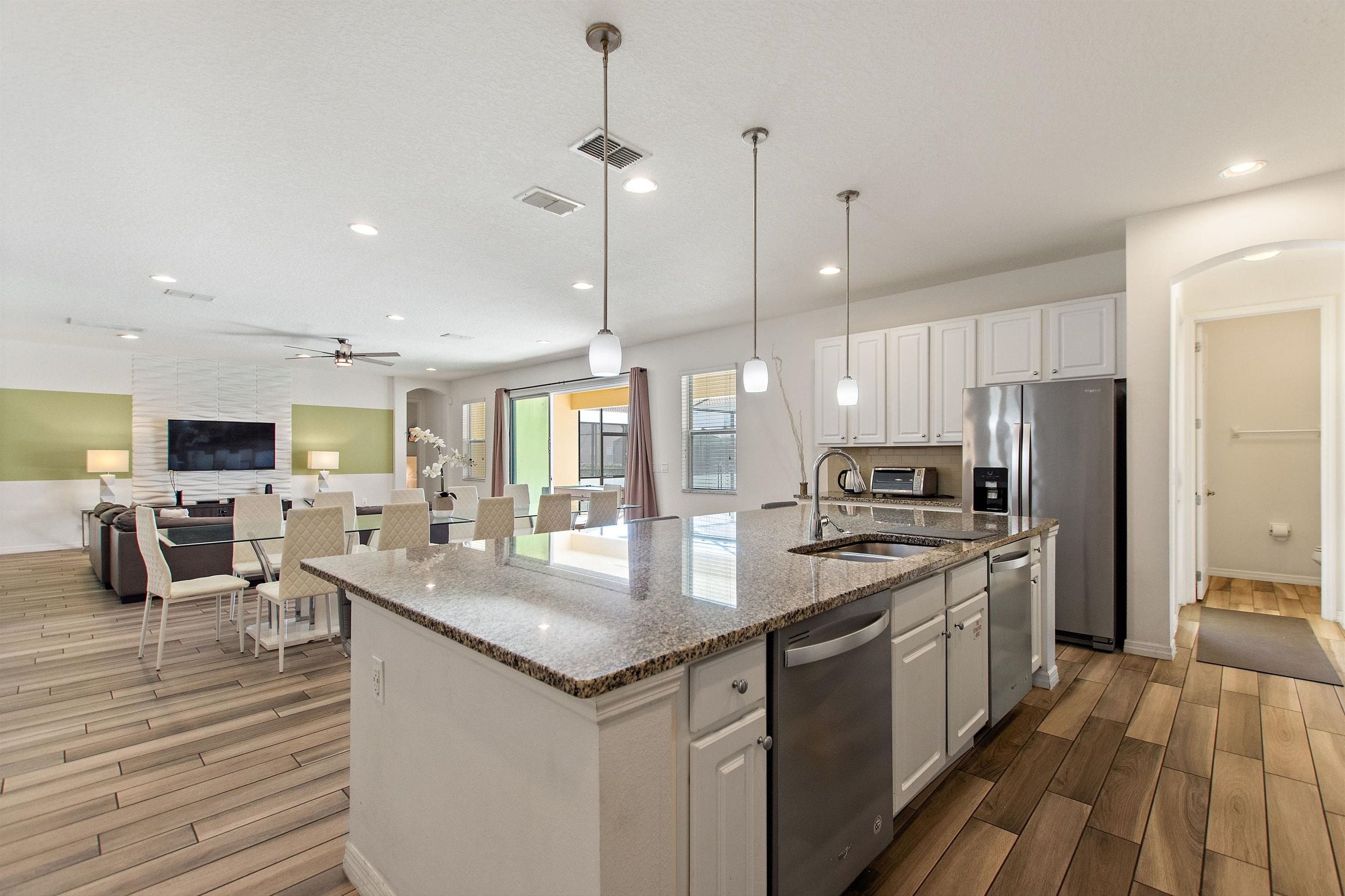 Kitchen Area w/ Stainless-steel Appliances and Large Island