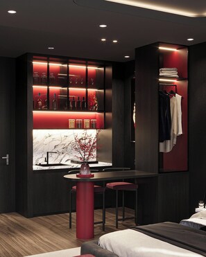 A modern interior with a bar area, seating, and a clothing rack. - ALIX Hotel By An Gia Hospitality (Ho Chi Minh City)