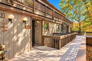 A wooden building with a deck, numbered signs, and a welcome sign. - 100ft to Slopes! True Ski-In/Out 3BR w/ 3 Baths (Tannersville)