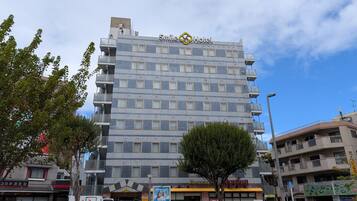 A multi-story hotel with a tiled facade and balconies.
